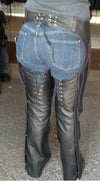 Milwaukee Leather purple and black leather motorcycle chaps for women with low-rise waist, double buckle, and reflective embroidery.