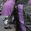 Milwaukee Leather Women's purple and black waterproof motorcycle rain suit with hood and adjustable straps, designed for riding in wet weather.