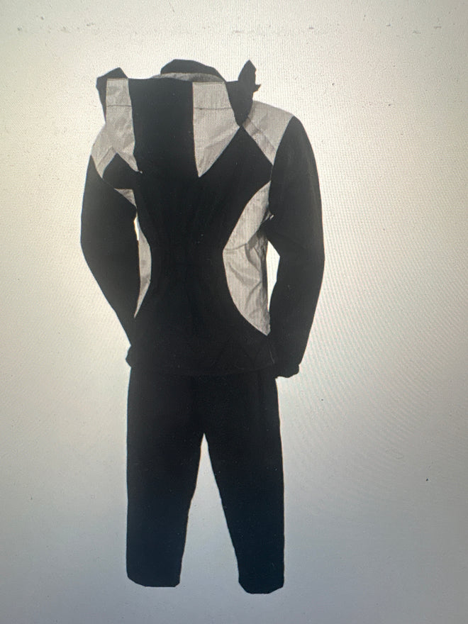 Grey women's motorcycle rain suit by FIRST MFG, waterproof rain gear designed for protection and comfort while riding.