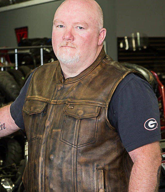 Buffalo Leather Gear men's beige and brown club style leather motorcycle vest with front pockets and adjustable straps.