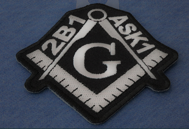 Mason symbol patch with ASK1 design on a 4x2.25 inch fabric patch, ideal for clothing or accessories.