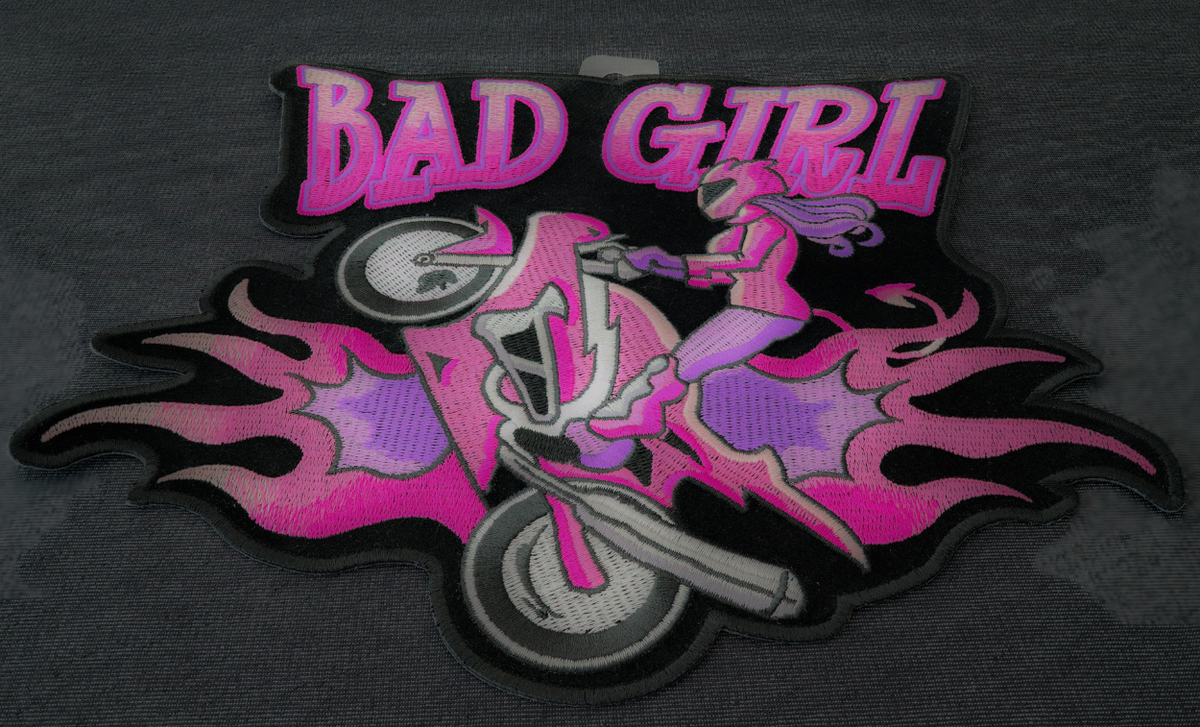 Embroidered Bad Girl Biker patch with iron-on backing, 10x9 inches, featuring detailed biker girl design on black fabric.