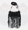 Front of black studded fringe hip bag hanging from its leather strap