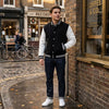 Men's Buffalo Leather Gear varsity baseball jacket with banded collar, black and white color, featuring leather trim and classic style.