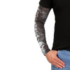 Hot Leathers ARM1004 five skulls arm sleeve with detailed black and gray skull design on a fabric sleeve for motorcycle or casual wear.
