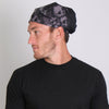 Hot Leathers Ancient Skulls bandana featuring detailed skull and tribal design in vibrant colors.
