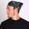 Green paisley skulls bandana by Hot Leathers, featuring bold paisley and skull design, shown flat on a neutral background.