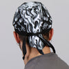 Hot Leathers Assassin Headwrap from DOO RAGS collection, featuring a bold graphic design and vibrant colors.