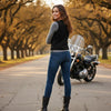 Buffalo Leather Gear women's denim motorcycle vest with side lace details and two inside ammo pockets, styled for casual or riding wear.