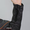 Men's black nylon jacket by Hot Leathers with orange reflective trim and zip-up front, designed for style and visibility.