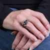 Hot Leathers rhinestone skull and bones stainless steel ring, detailed close-up of accessory with engraved design and sparkling stones.