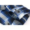 Close-up of Milwaukee Leather NexGen MNG11635 men's blue and white long sleeve cotton flannel shirt showing fabric texture and collar detail.