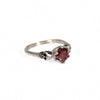 Red stone small skull stainless steel ring from Hot Leathers, styled as a bold accessory with detailed skull design.