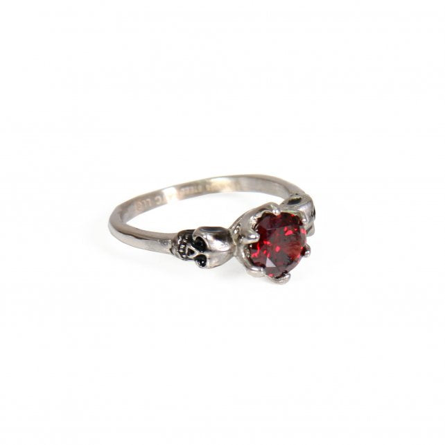 Red stone small skull stainless steel ring from Hot Leathers, styled as a bold accessory with detailed skull design.