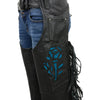 Milwaukee Leather Women's black leather motorcycle chaps with braided fringes and turquoise rose embroidery, close-up view.