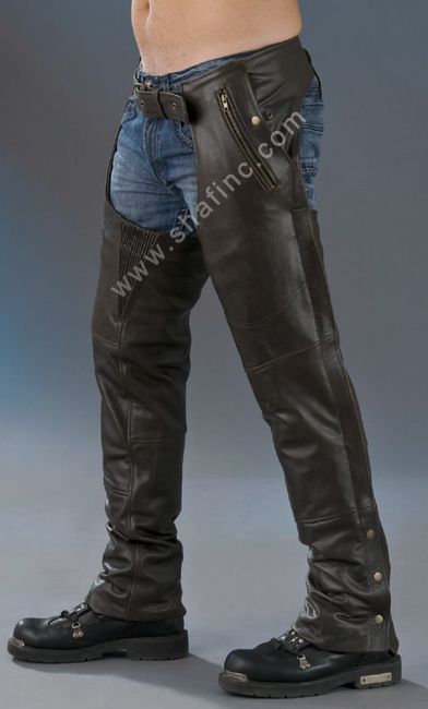 Brown Deluxe Chaps by Dynamicleather, featuring detailed leather design and sturdy hardware, displayed on a hanger.