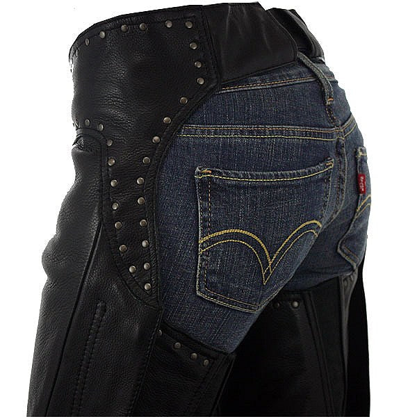 Studded women’s leather chaps, hip hugger style by FIRST MFG, featuring metal studs and a close-fitting design.