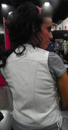Women’s white leather vest with side strings from Dynamicleather, featuring a fitted design and stylish detail.