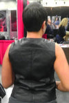 Back view of women's crop leather motorcycle vest by Dynamicleather, featuring a fitted design and classic motorcycle style.