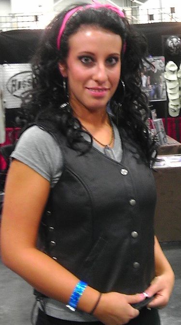 Women's Harley style side-lace vest by Dynamicleather, longer length women's vest with lace-up sides and a rugged leather look.