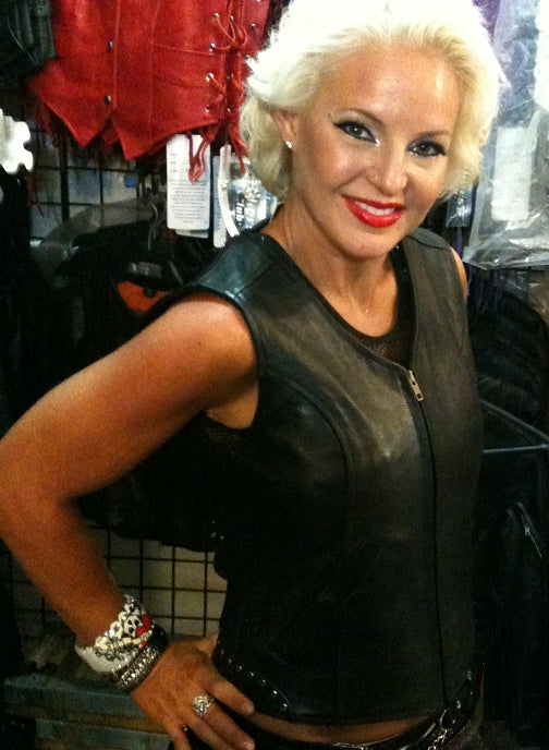 Women’s leather vest by HighwayLeather with rivet design and back zipper, featuring a stylish Harley-inspired rivet pattern.