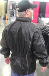 Dynamicleather unisex rain suit with jacket and pants, shown from the back, waterproof fabric in a practical rain protection design.