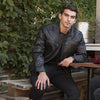 HighwayLeather Cruiser men's leather jacket, black with silver zipper details and classic style, displayed on a hanger.