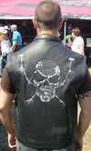Back view of Dynamicleather skull leather biker vest featuring metal skull embellishments and adjustable straps
