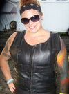 Front view of a woman wearing the black leather motorcycle vest.