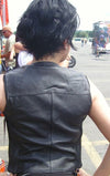 Black women’s leather vest with side stretch panels and front snap closure, by Dynamicleather, shown from the back.