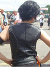 Back view of women's leather vest with rivet design and front zipper by Dynamicleather, showcasing a stylish women's vest.