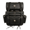 Large 2-piece PVC studded touring sissy bar bag on motorcycle, black with silver hardware, for highway travel.