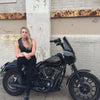 Black leather motorcycle vest by Dynamicleather featuring metal hardware and a classic fit, displayed on a mannequin.