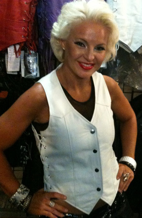 Women’s white side lace leather club vest by Dynamicleather, featuring a fitted design with lace accents on the sides.